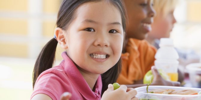 Shutterstock Girl Eating Grapes