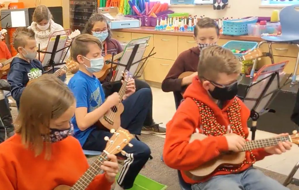 Students playing the ukulele